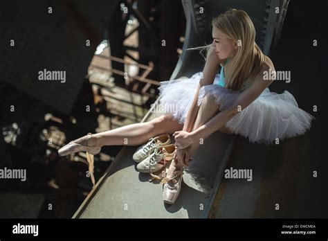 Ballerina Sitting On The Edge Of Bridge Stock Photo Alamy