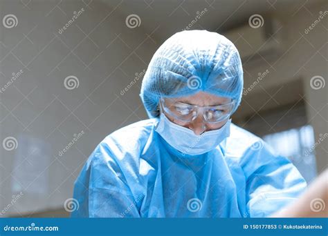 Portrait Confident Serious Female Surgeon In Surgical Room Hospital