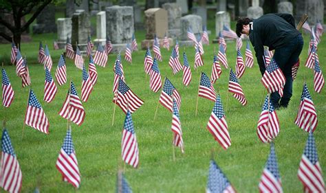 Veterans honored with flags - Catholic Courier