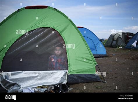 A boy from Syria is seen inside a tent, at the refugee camp in the ...