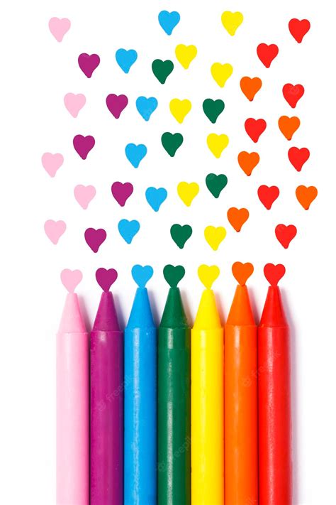 Premium Photo Rainbow Colored Crayons With Decorative Hearts