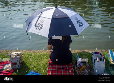 A Lady With An Official Henley Royal Regatta Umbrella Picnics On The