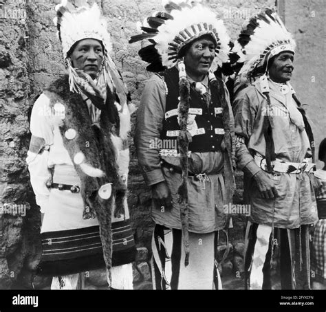 Three Native American chiefs. dressed in traditional clothing and ...