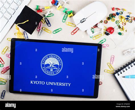 In this photo illustration, Kyoto University logo seen displayed on a tablet Stock Photo - Alamy