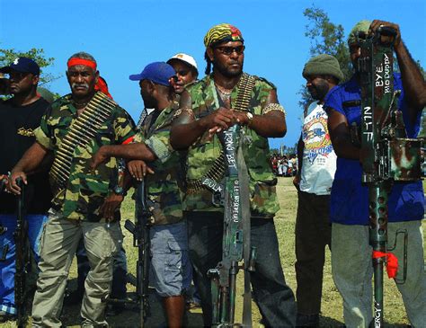 2 MEF commander Jimmy Rasta Lusibaea (centre) and other MEF members ...