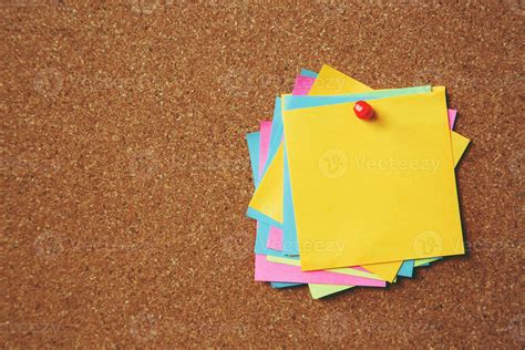 colorful sticky notes on cork bulletin board 10569421 Stock Photo at Vecteezy