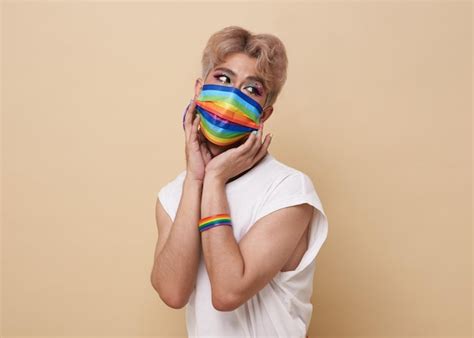 Premium Photo Youth Asian Transgender Lgbt Wear Rainbow Mask Isolated Over Nude Color Background