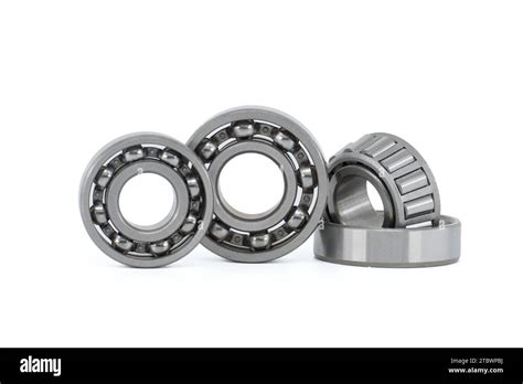 Set of various ball and roller bearings on white background. Car bearings, auto parts ...