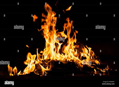 Fire flames burning isolated on black background. High resolution wood ...