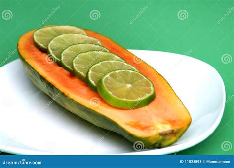 Papaya with Lime Slices stock image. Image of fresh, indigestion - 11028593