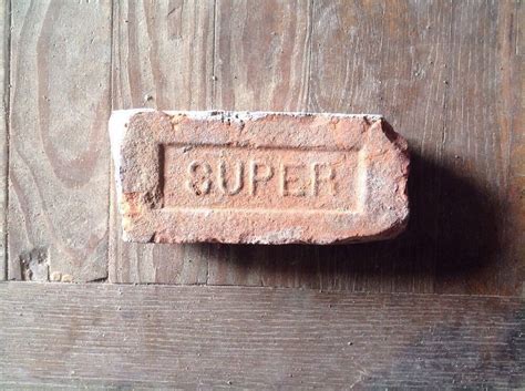 Antique Brick Stamped With The Letter Super Antique Brick