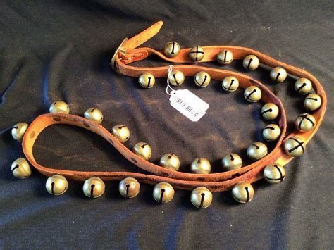 At Auction Brass Sleigh Bells On Leather Strap