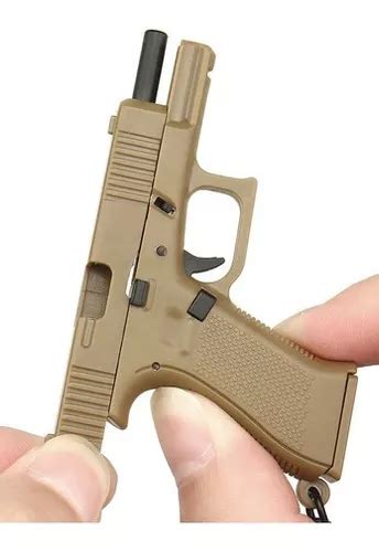 Chaveiro Mini Pistola Glock G Escala Sai Carregador