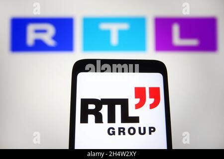 In This Photo Illustration The RTL Logo Is Displayed On A Smartphone