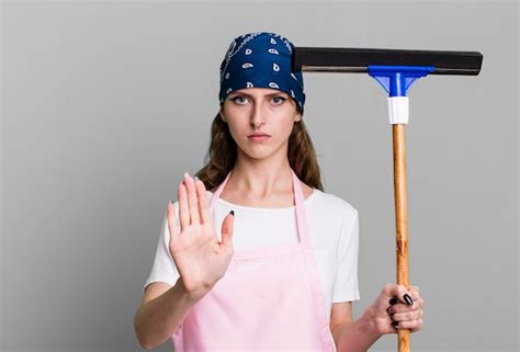 Premium Photo Caucasian Pretty Blonde Woman Housekeeper And Cleaning Windows Concept