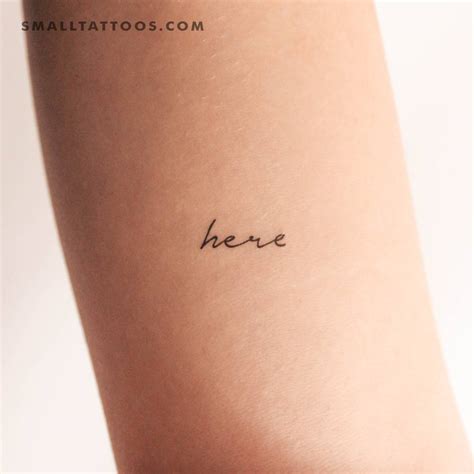 Temporary Tattoo Of The Word Here Placed On The Inner