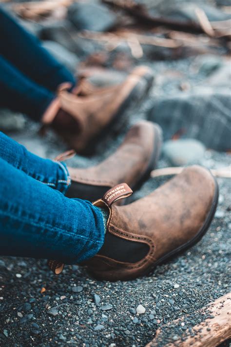 Person in Blue Denim Jeans and Brown Leather Shoes · Free Stock Photo