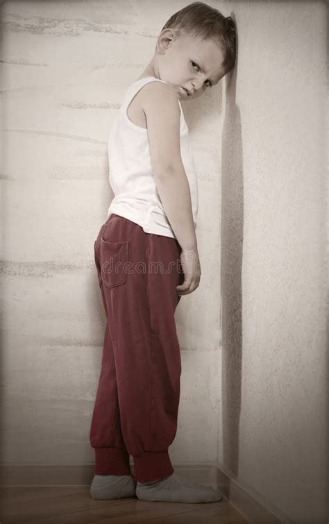 Little Boy Standing in a Corner Sulking Stock Photo - Image of facial, frustrated: 43435548