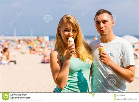 Man And Woman Eating Ice Cream On Beach Stock Photo Image Of