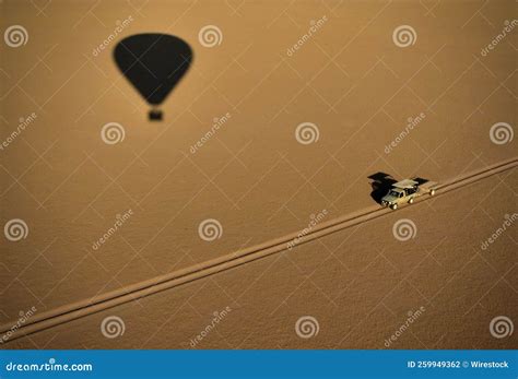 Aerial View Of A Hot Air Balloon Shadow On A Desert Road Stock Photo Image Of Vacation Desert