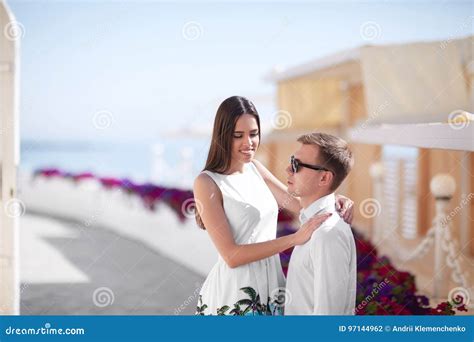 Happy Honeymoon Of A Fall In Love Couple Is Walking Outdoors A Beautiful Couple On A Summer