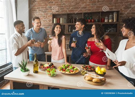 Group of Friends Talking during Home Party Stock Photo - Image of ...