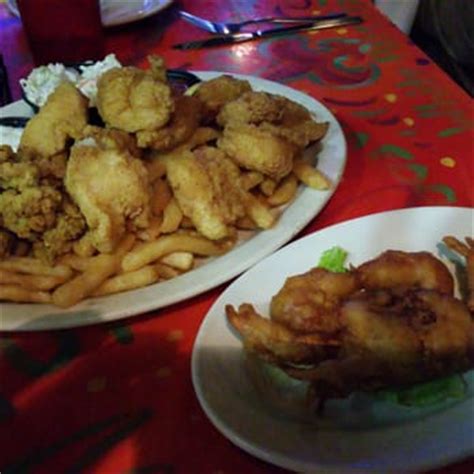 Oceana Grill - Seafood Platter with catfish, shrimp, oysters, jalapeño hush puppies, fries, cole ...