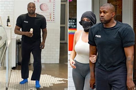 Two Men And One Woman Are Seen Walking Through The Store While Another Man Is Wearing A Face Mask