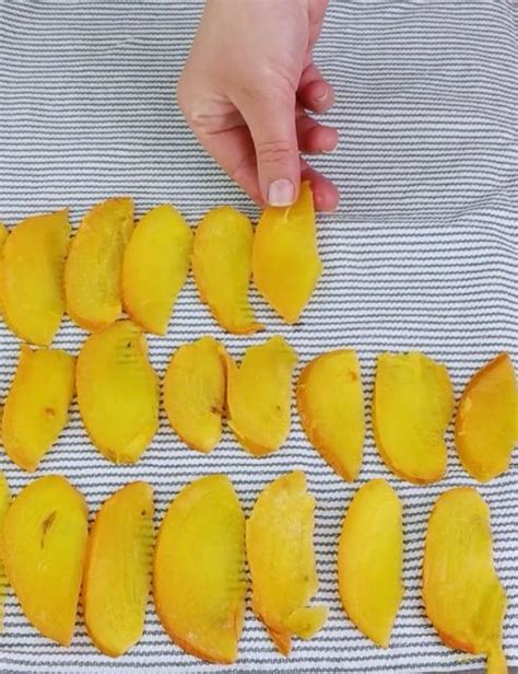 Someone Is Peeling The Skin Off Of A Mango