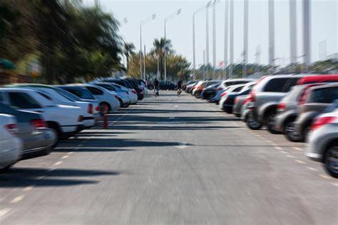 Blurry Image Of Cars Parked In A Parking Lot Stock Photo Download