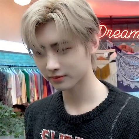 A Man With Blonde Hair Wearing A Black Sweater