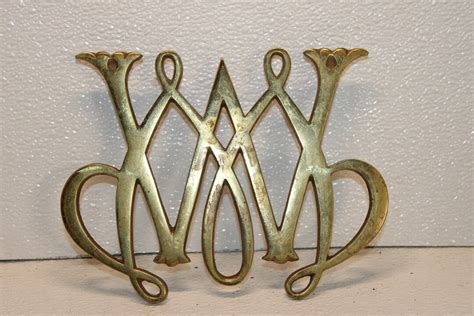 Vintage Copyright William And Mary Brass Footed Trivet Scroll