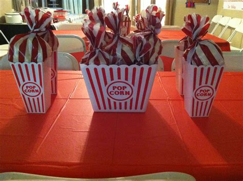 Popcorn Centerpieces And Favor Bags In One Big Popcorn Tub And 4 Smaller Containers All Bought At