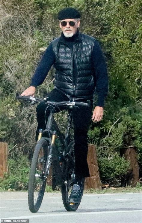 Pierce Brosnan Looks Dapper In A Beret And Aviator Shades For A Solo