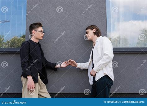 Side View Of Gay Partners Holding Stock Image Image Of Sunglasses Partners