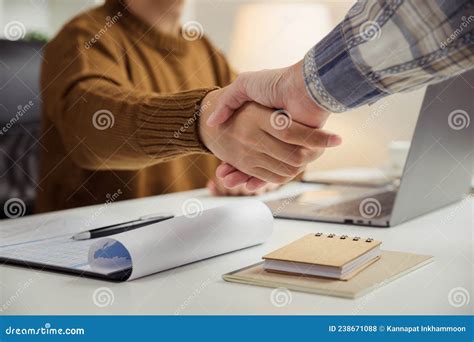 Two Business People Handshake After Agreeing To Work Together Stock