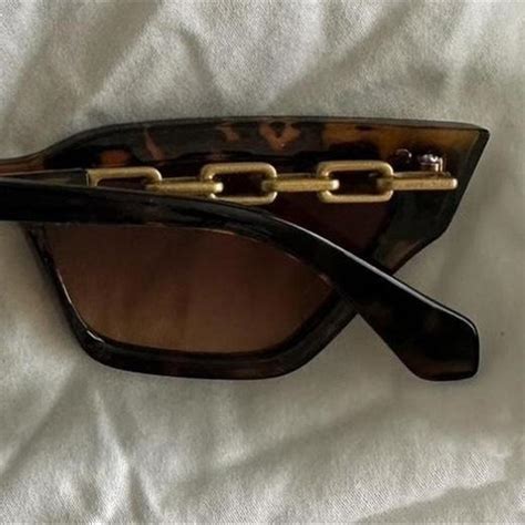 Brown cat eye sunglasses with gold detailing - Depop