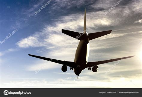 Airplane flying in the clouds — Stock Photo © semisatch #164460656