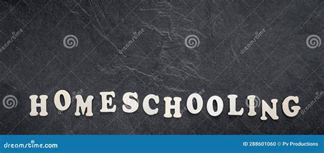 Homeschooling Word Made Of Wooden Letters On A Black Background Top