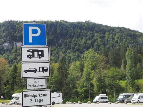 Road Signs In German In Background Of Mountains Editorial Photography