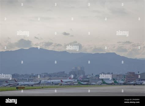 Taipei Songshan Airport, mountains in the background Stock Photo - Alamy