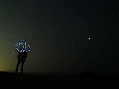 Premium Photo Rear View Of Silhouette Person Standing On Illuminated