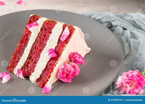 Red Velvet Naked Cake With Fresh Roses And Swiss Buttercream On Kitchen Countertop Stock Image