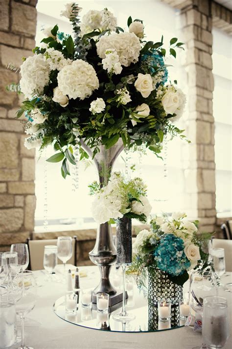 elegant wedding reception centerpieces ivory hydrangeas teal accents | OneWed.com