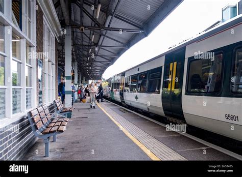 epsom surrey england uk november   passengers boarding