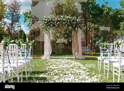 Arch For The Wedding Ceremony Decorated With Cloth And Flowers Stock