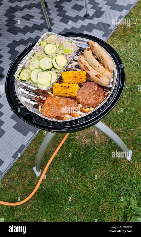 Gas Grill With Bratwurst And Peppers Stock Photo Alamy