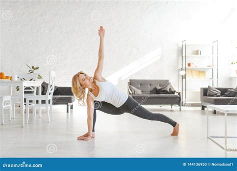 Yuong Woman Sitting on the Floor in Yoga Pose Stock Photo - Image of ...