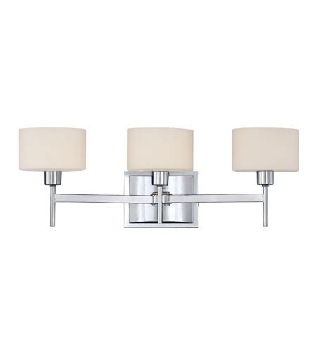 Three Light Bathroom Fixture In Chrome Finish With White Shades On The