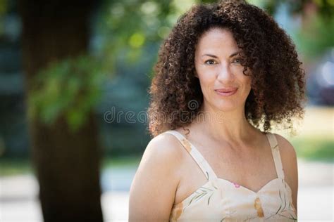 Mature Sensual Woman Smiling At The Camera She Is Outside At The Park Stock Image Image Of